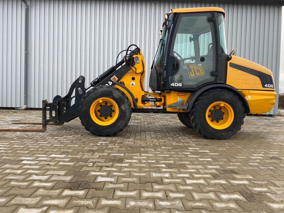 Radlader 4700 kg JCB 406 mit Palettengabel mieten bei menzinger – 2