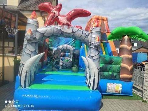 Hüpfburg mieten Dino Vulkan mit Rutsche – Profi Springburg 5,5x4x4 m inkl. Zubehör