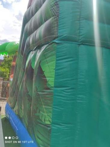 Hüpfburg mieten Dino Vulkan mit Rutsche – Profi Springburg 5,5x4x4 m inkl. Zubehör – 3