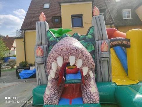 Hüpfburg mieten Dino World T-Rex mit Rutsche – Profi Springburg 4x4x4 m inkl. Zubehör – 3